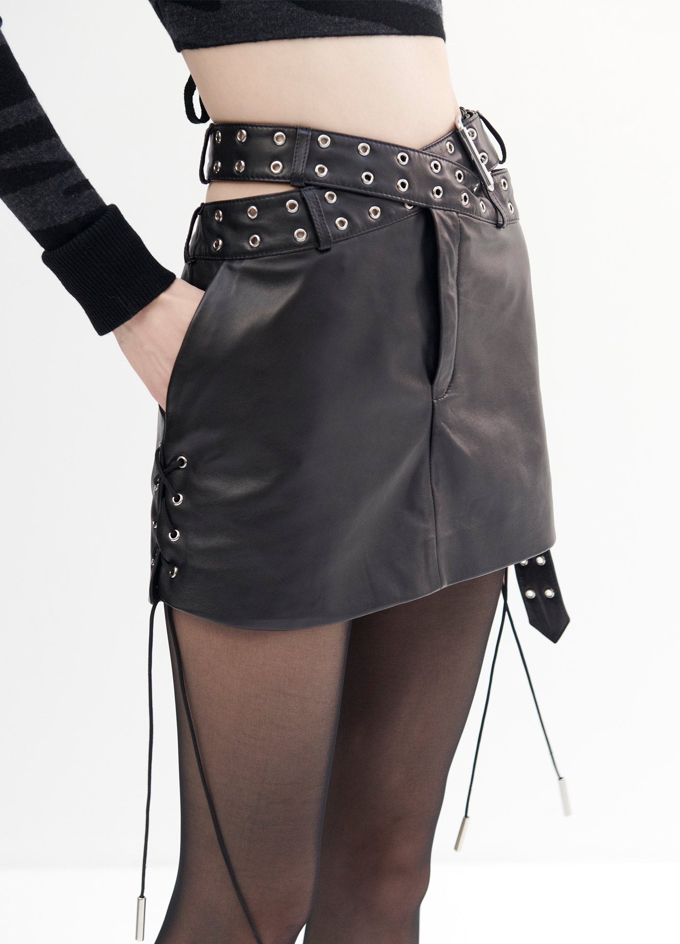 MONSE Leather Criss Cross Mini Skirt in Black on Model Front Detail View