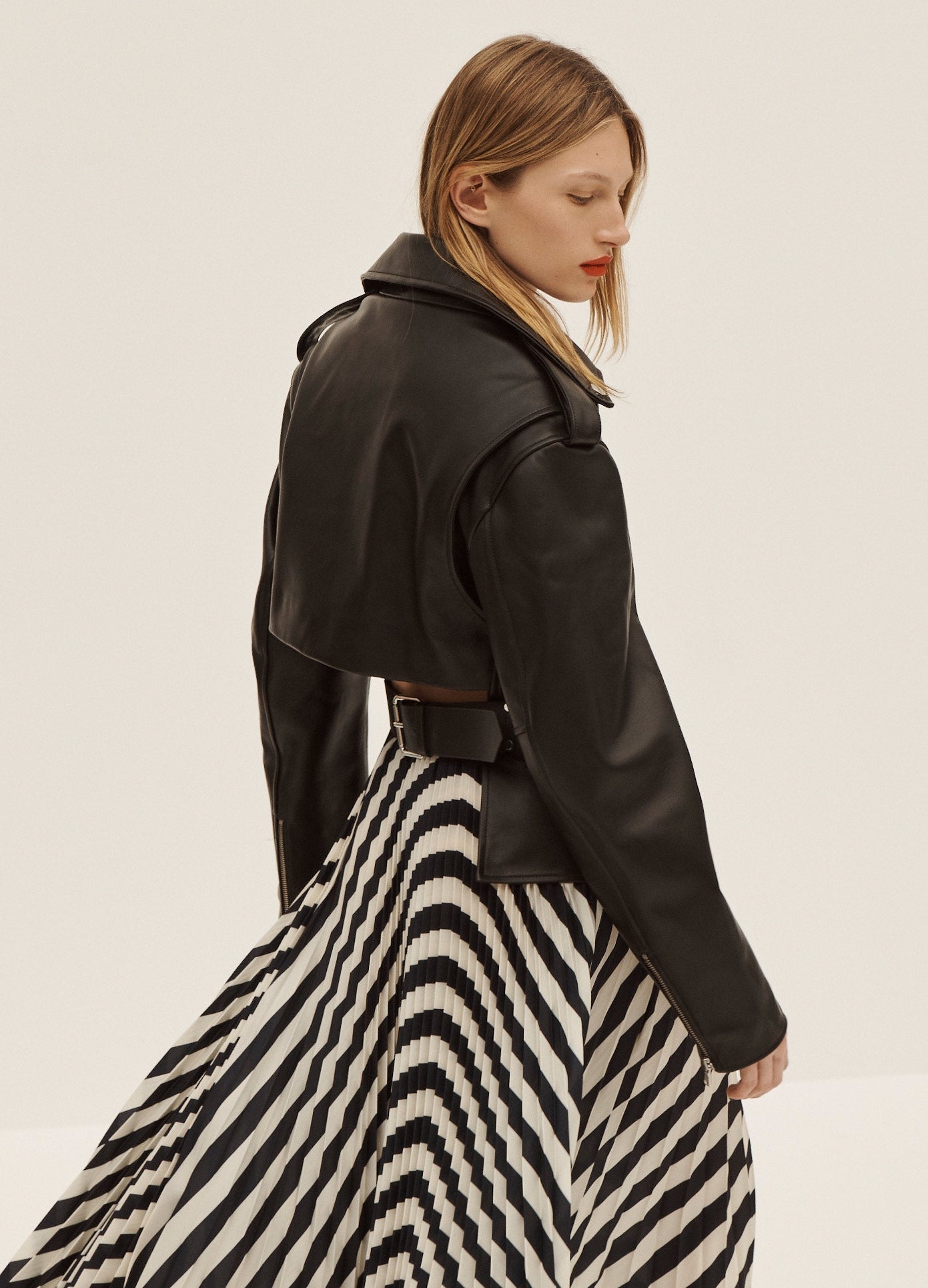 MONSE Long Pleated Skirt in Navy and Ivory on Model Side View
