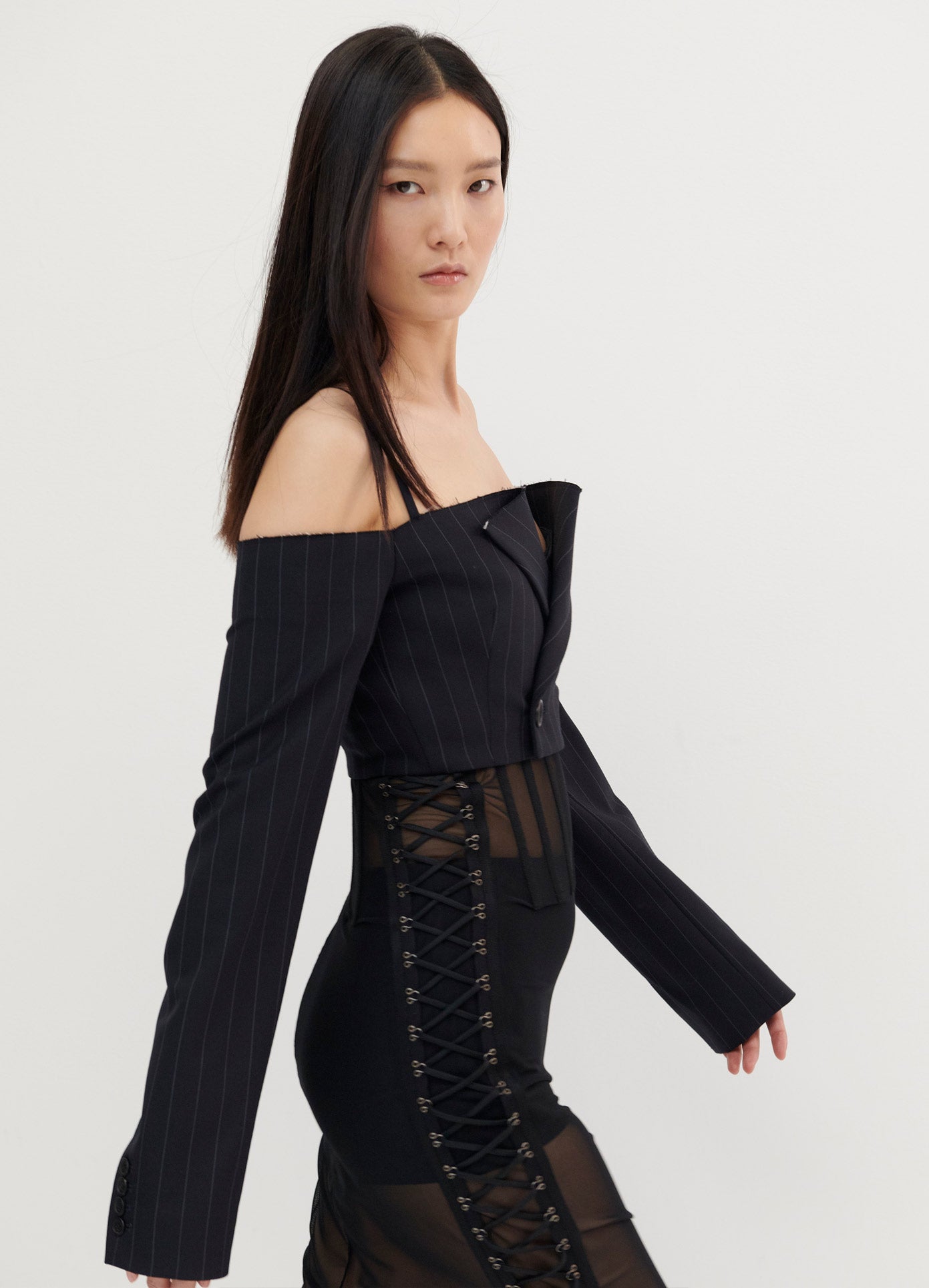 MONSE Off the Shoulder Cropped Jacket in Midnight on Model Walking Right Side View