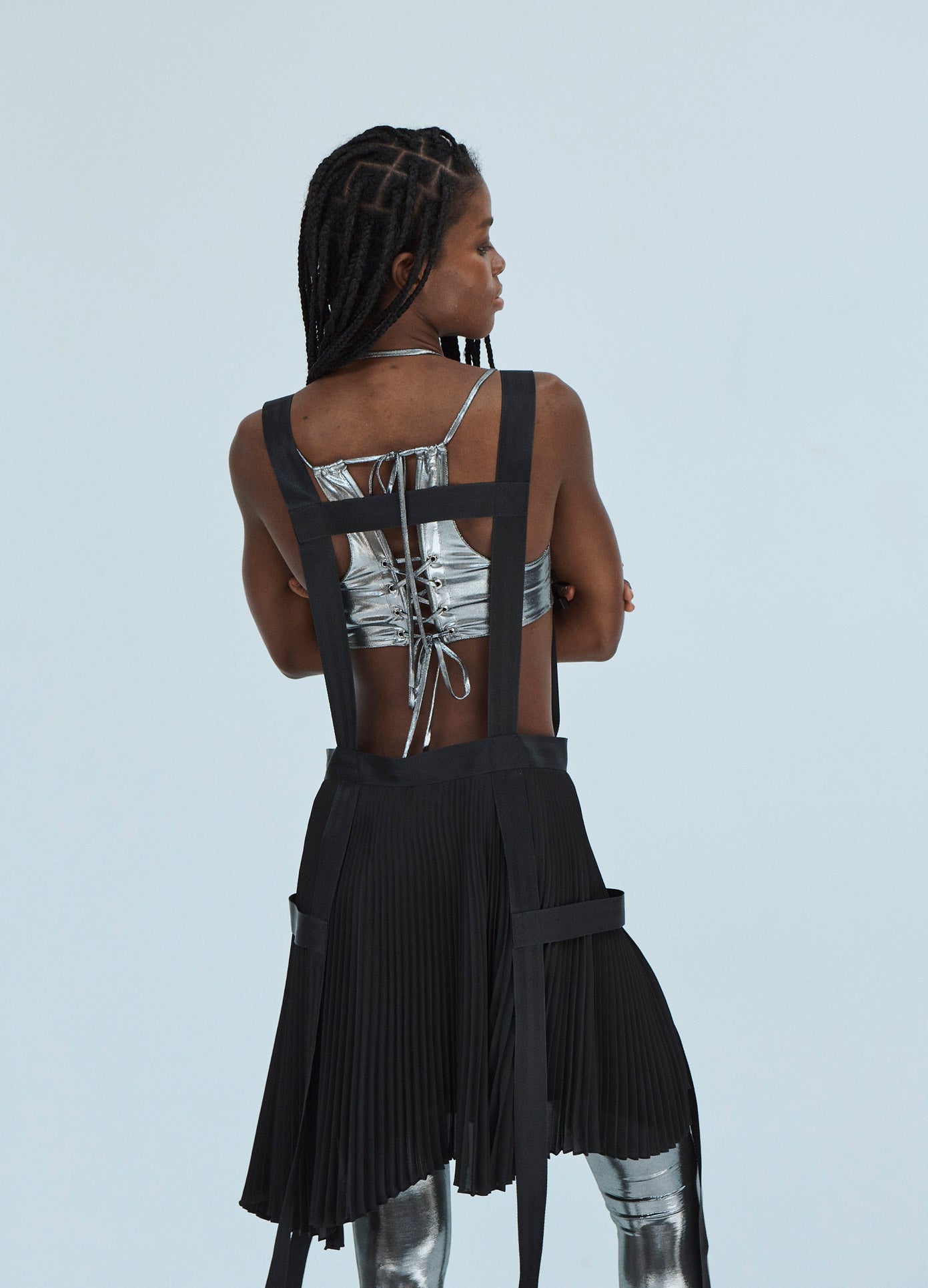 MONSE Pleated Harness Detail Skirt in Black on Model Back View