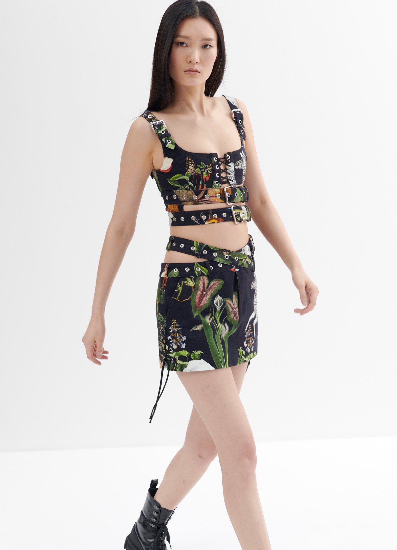 MONSE Print Criss Cross Mini Skirt in Black Print on Model Walking Front View