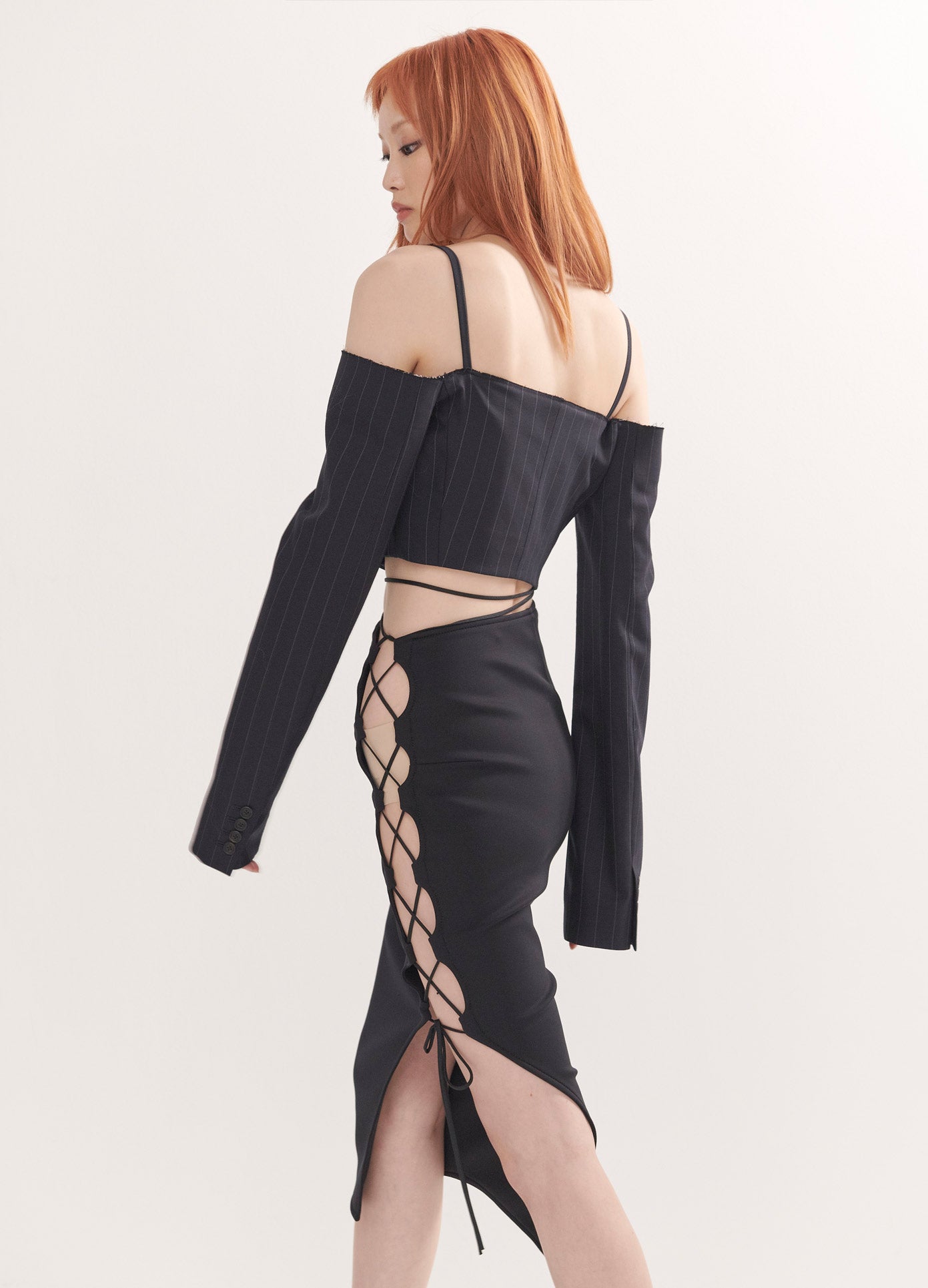 MONSE Scuba Side Laced Detail Skirt in Black on Model Walking Side View