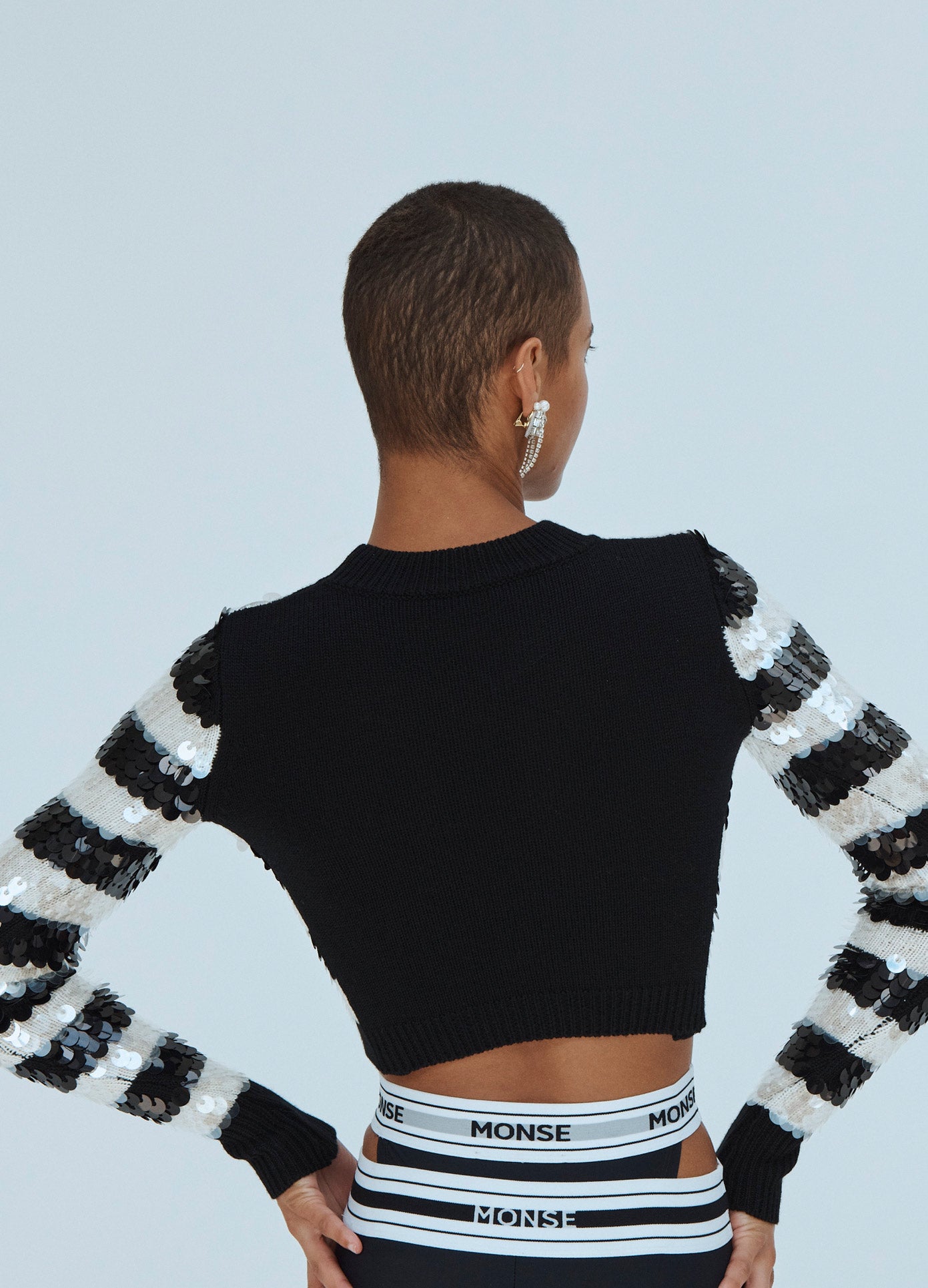MONSE Sequin Striped Cropped Sweater in Black and Ivory on Model Back View