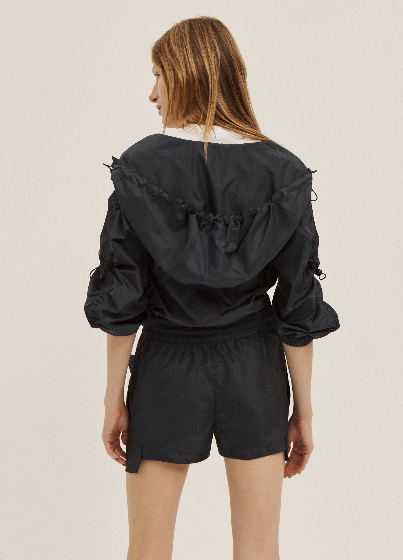 MONSE Short Hooded Jumpsuit in Midnight on Model Back View