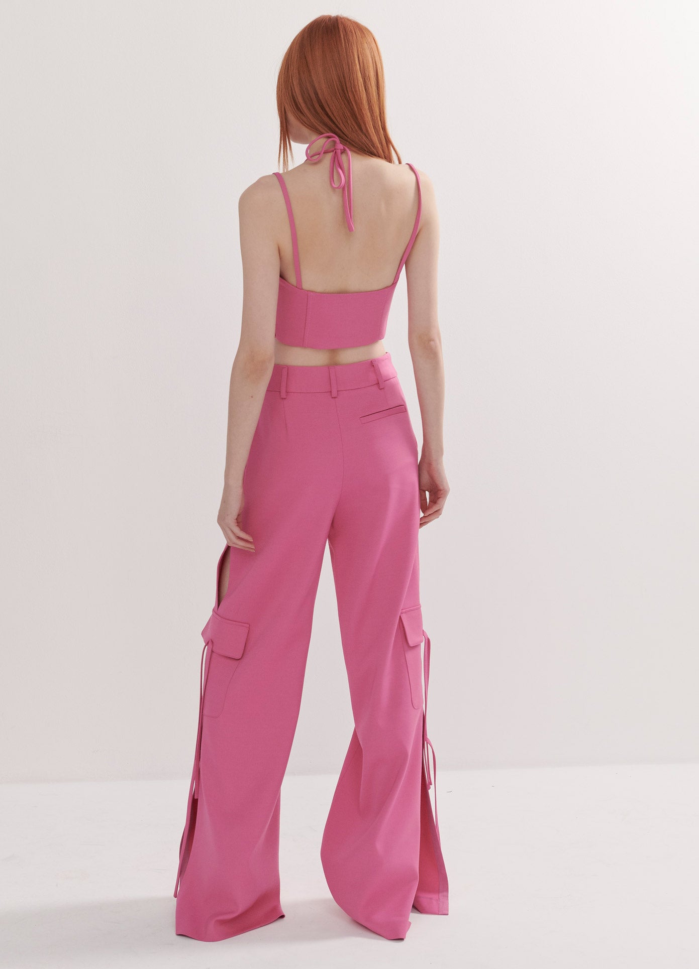 MONSE Side Slit Cargo Pants with Chain in Pink on Model Full Back View