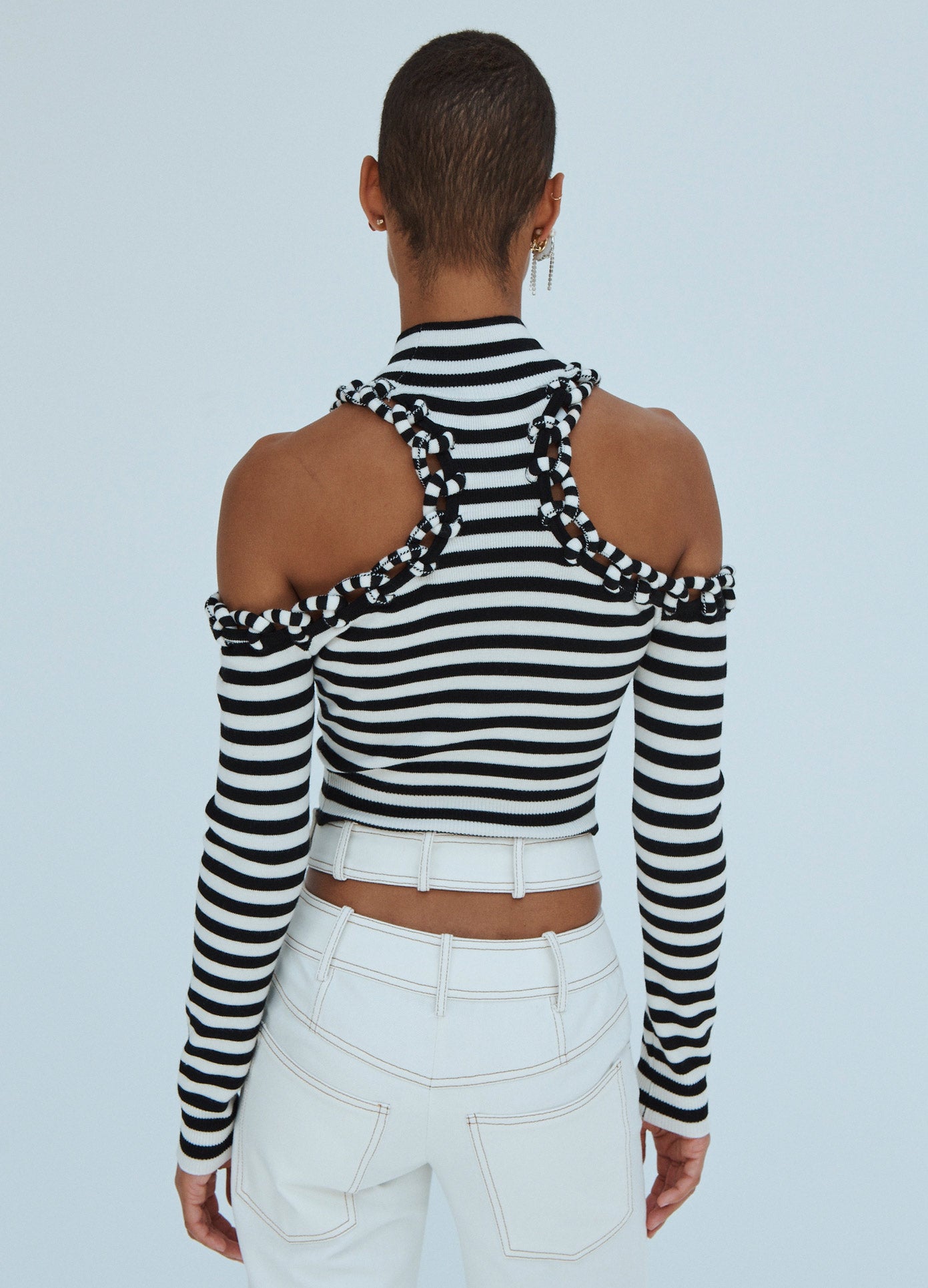 MONSE Stirped Cropped Cold Shoulder Turtleneck in Black and Ivory on Model Back View