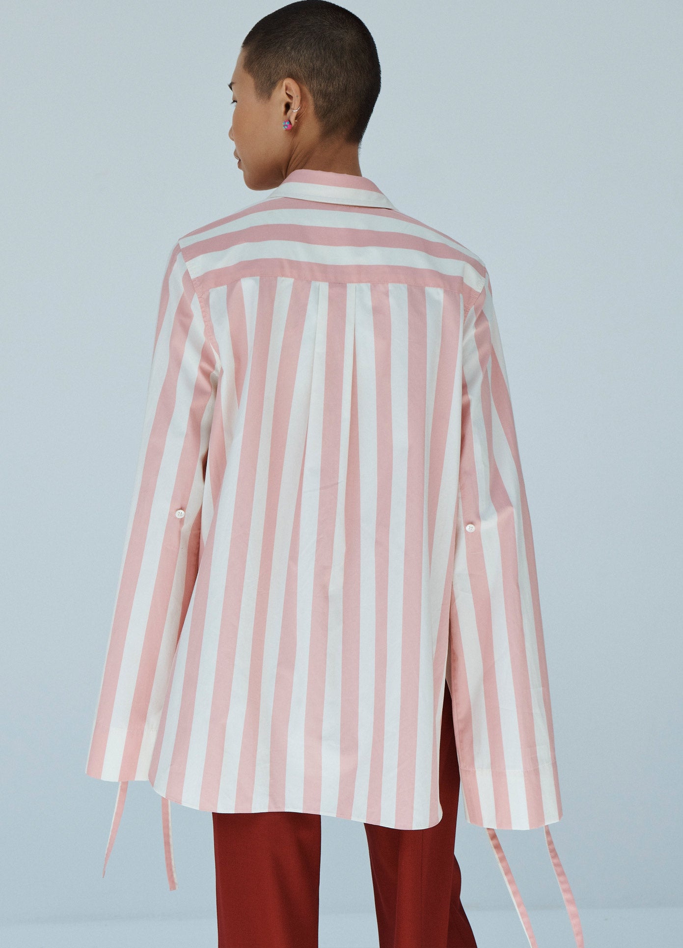 MONSE Striped Long Sleeve Shirt in Pink and Ivory on Model Back View