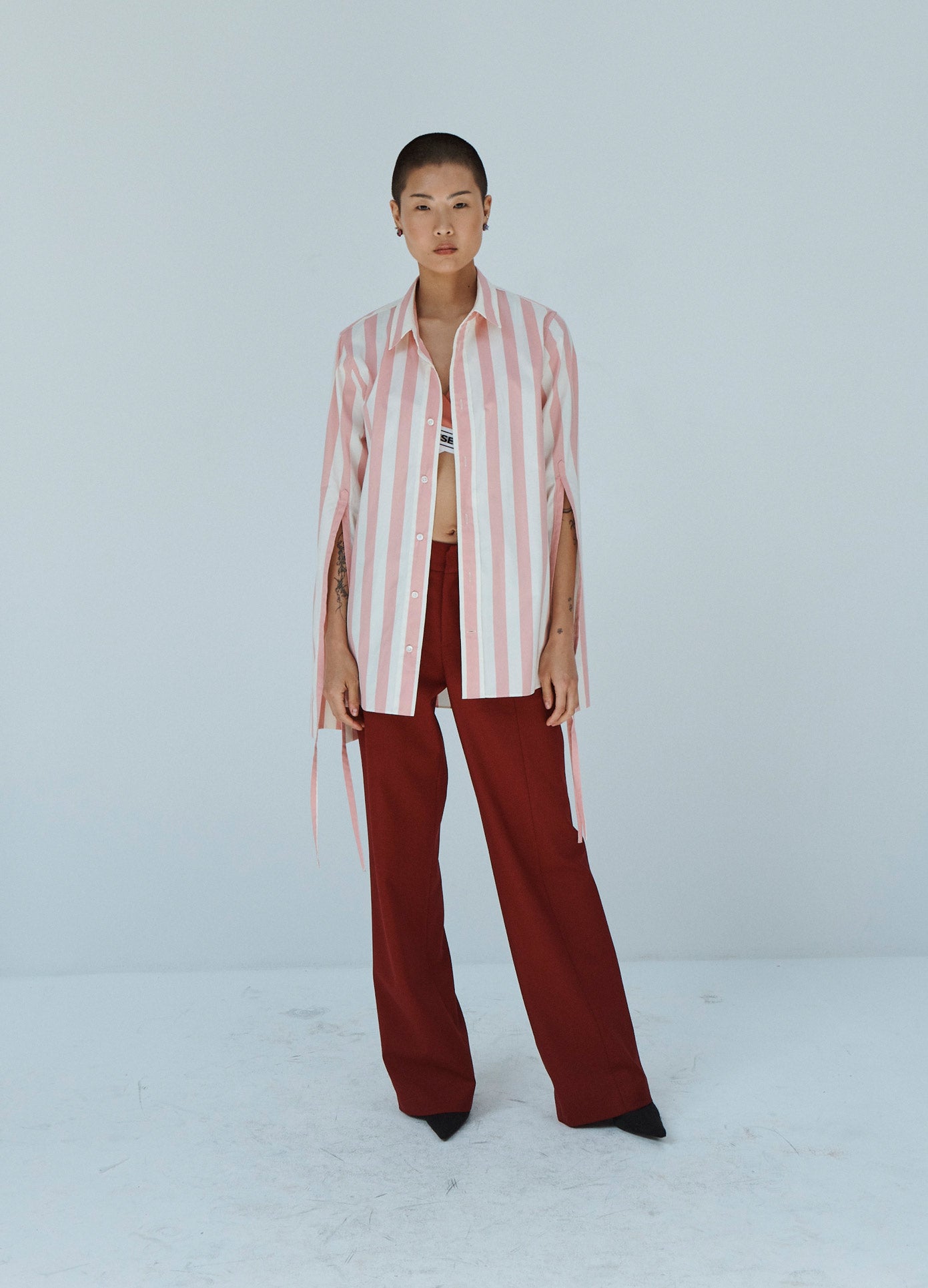 MONSE Striped Long Sleeve Shirt in Pink and Ivory on Model Front View