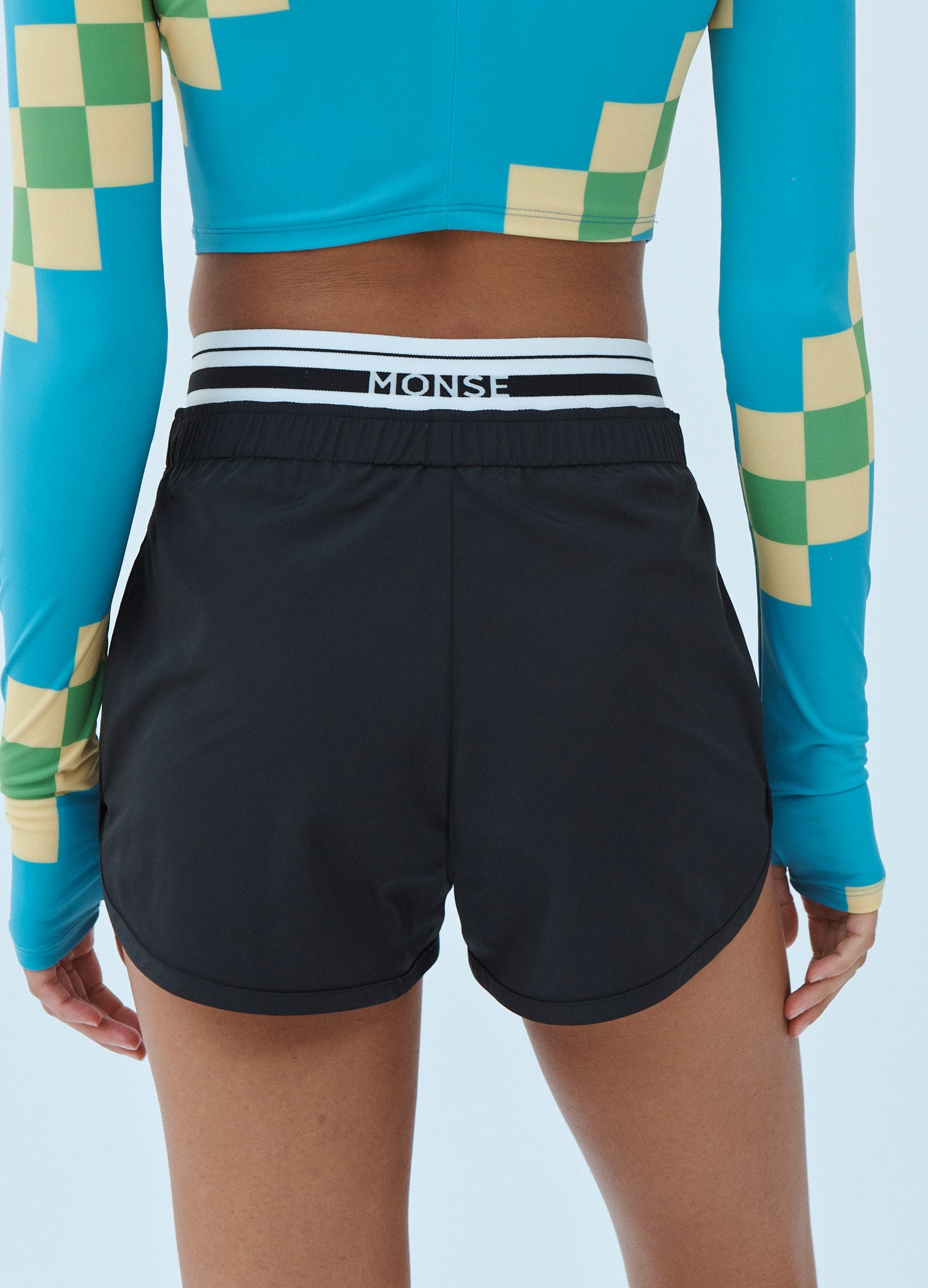 MONSE Techno Shorts with Waistband Detail in Midnight on Model Back Detail View