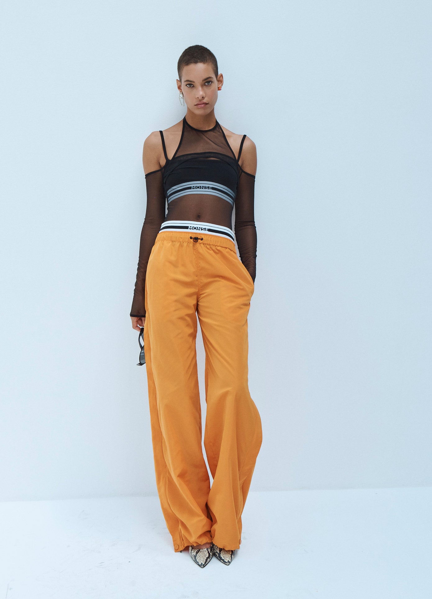 MONSE Techno Waistband Detail Parachute Pant in Orange on Model Front View