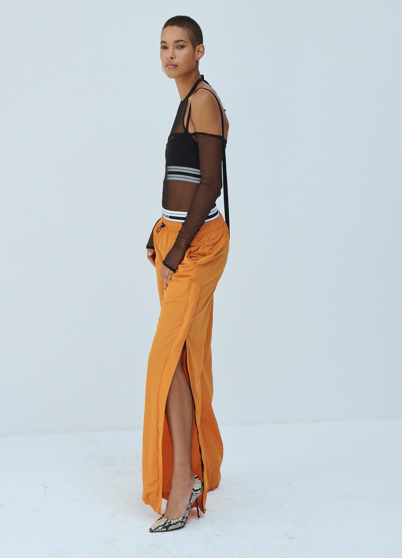 MONSE Techno Waistband Detail Parachute Pant in Orange on Model Side View