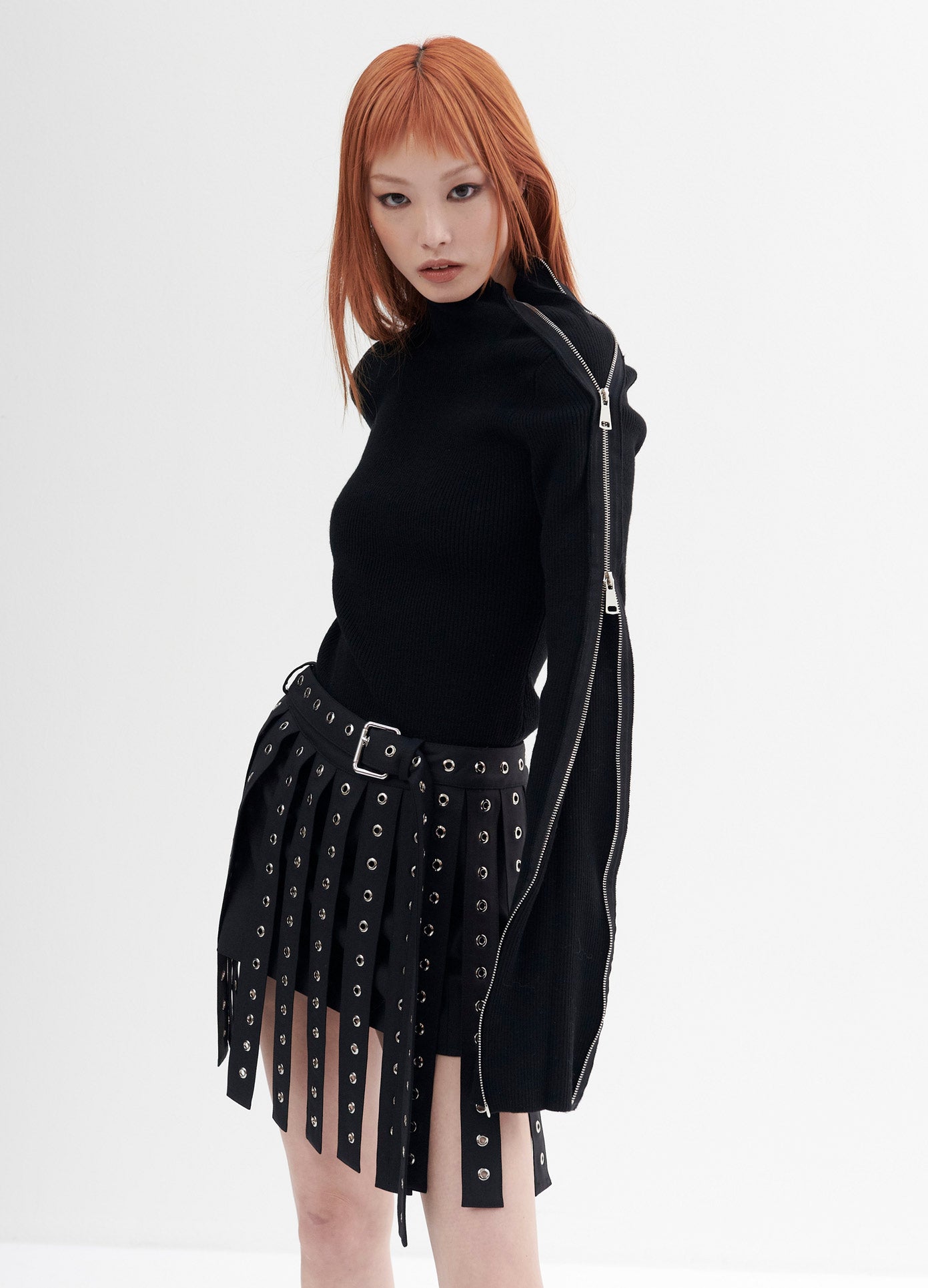 MONSE Zipper Detail Turtleneck Sweater in Black on Model Looking Intensely Side View